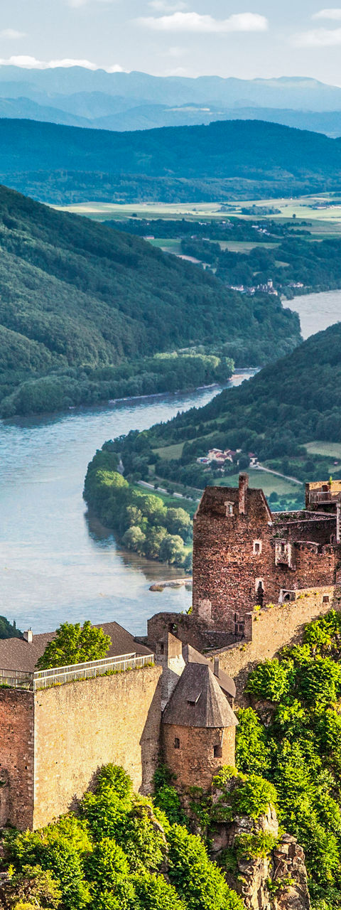 Scenic castle ruins overlooking lush valley