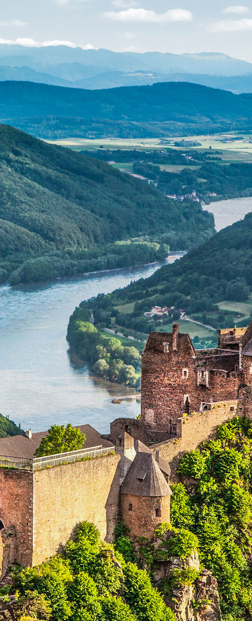 Scenic castle ruins overlooking lush valley
