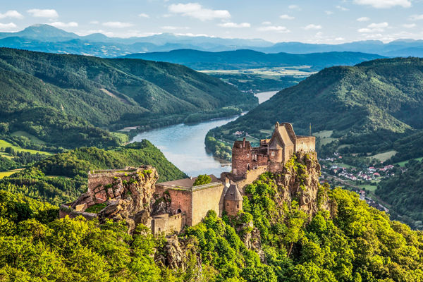 Scenic castle ruins overlooking lush valley