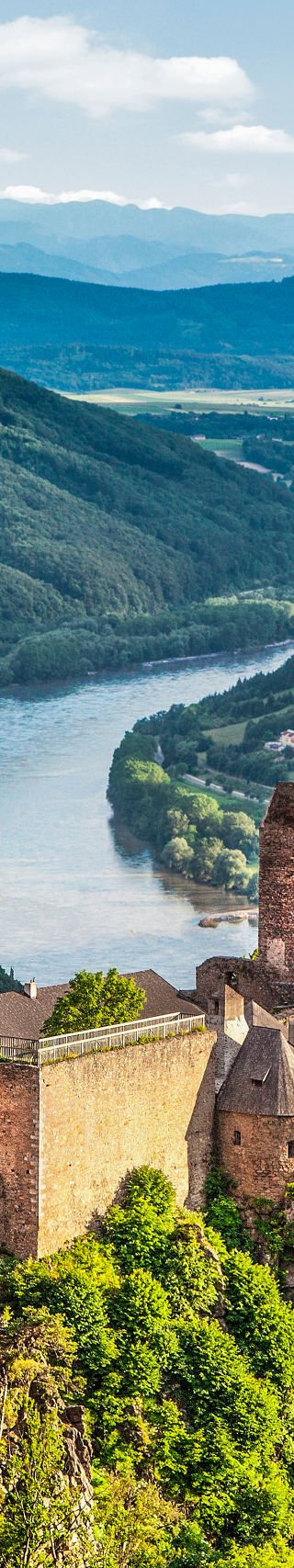 Scenic castle ruins overlooking lush valley