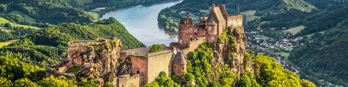 Scenic castle ruins overlooking lush valley