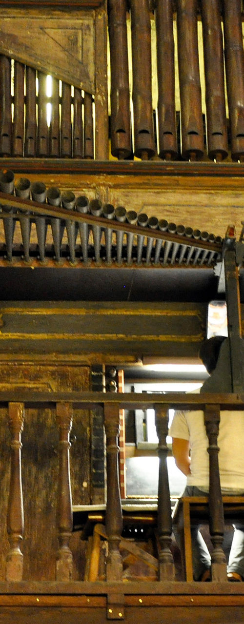 Historic wooden pipe organ in rustic setting