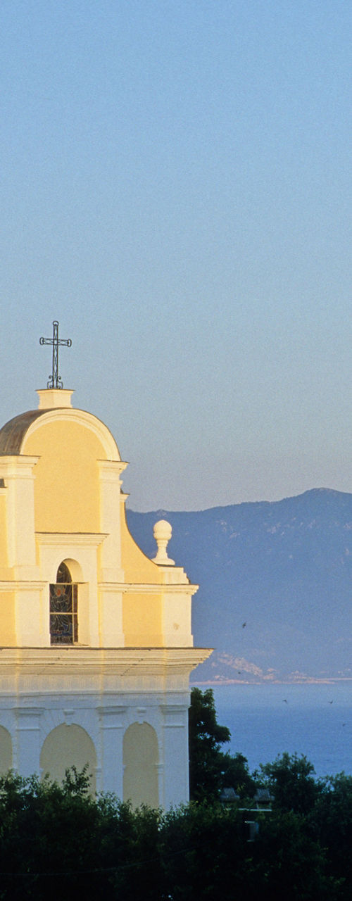 Historic coastal church at sunset