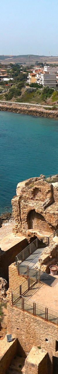 Coastal ruins overlooking serene blue waters