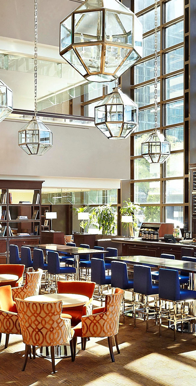 Modern restaurant with large windows and seating