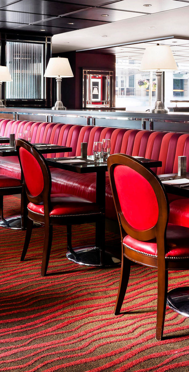 Elegant restaurant interior with red seating