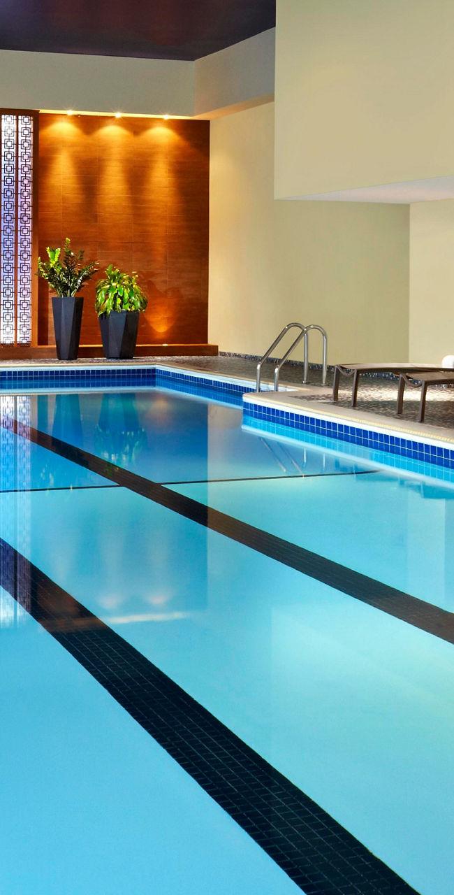 Indoor swimming pool with lounge chairs