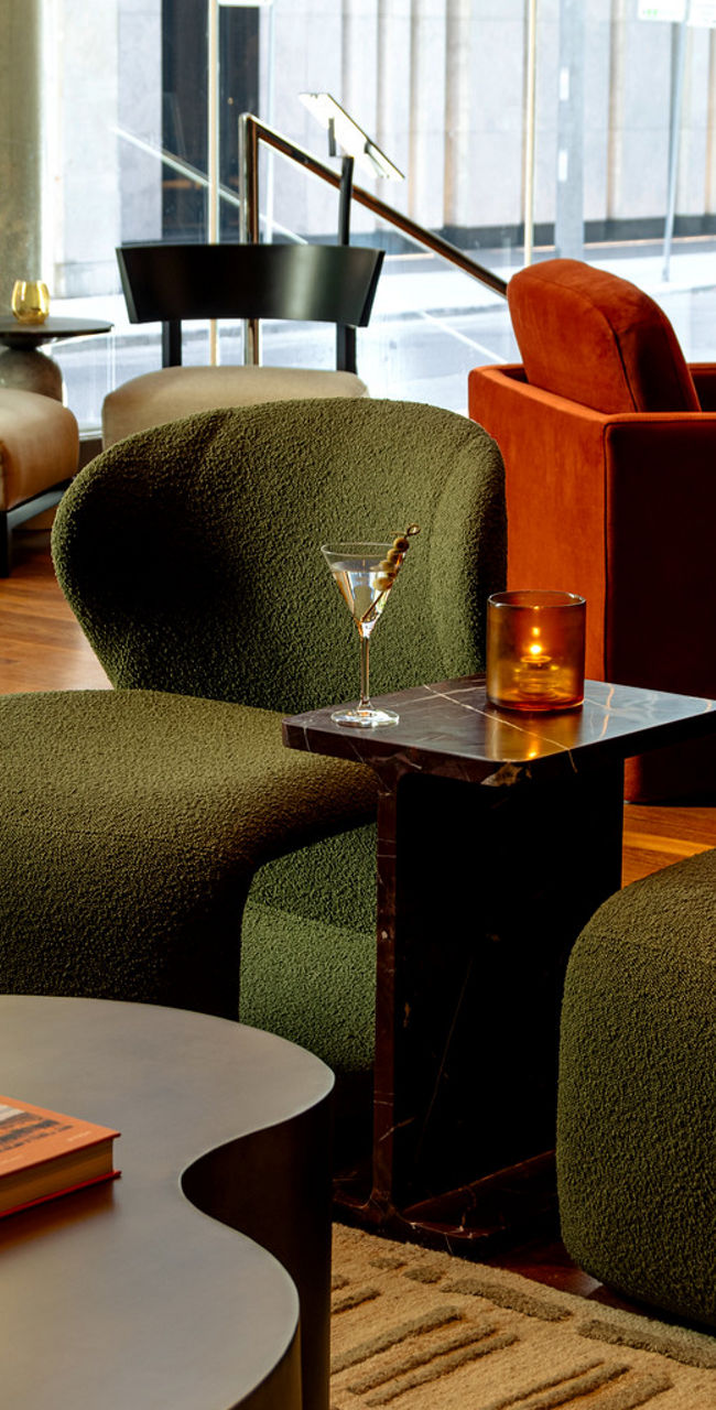 Modern lounge with cozy seating and cocktails