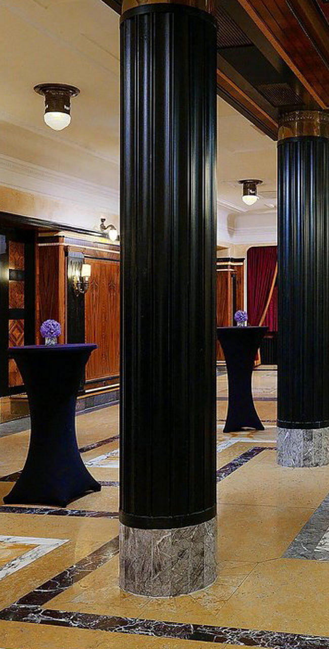 Elegant Hotel Lobby with Marble Columns and Buffet Table