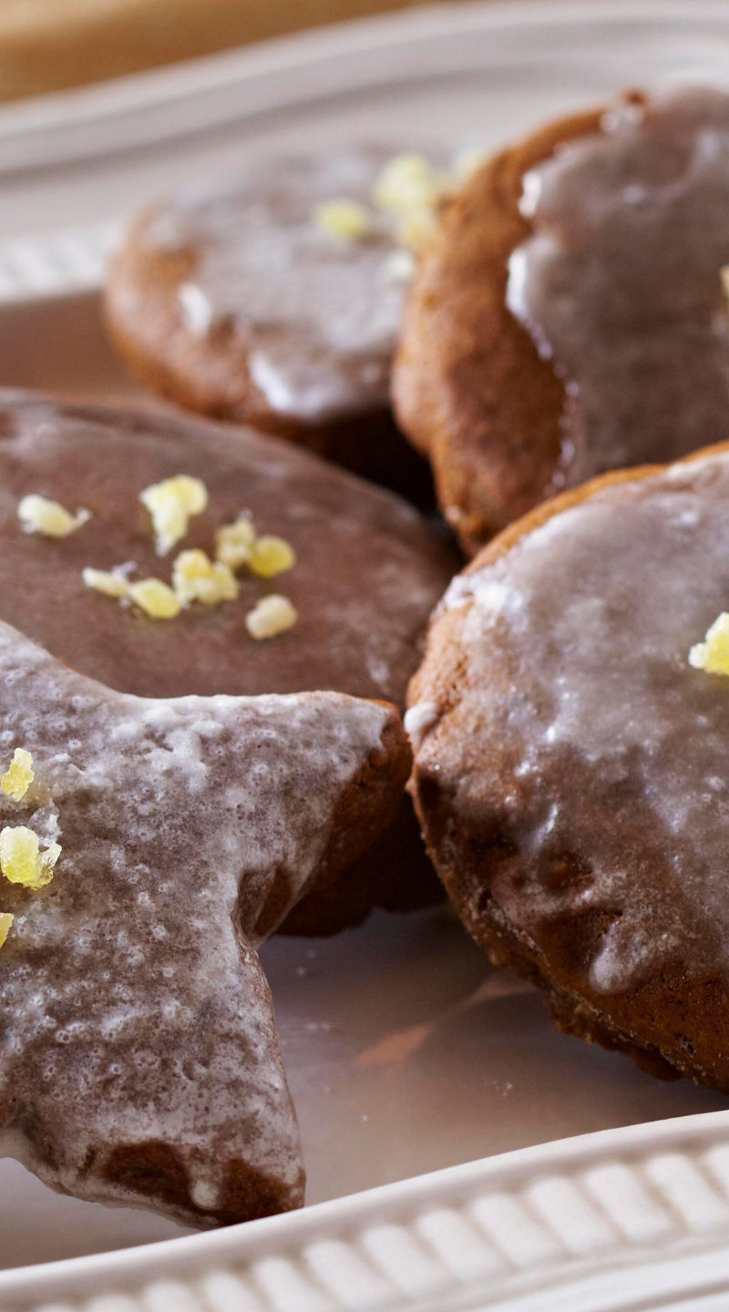 Iced gingerbread cookies on white plate