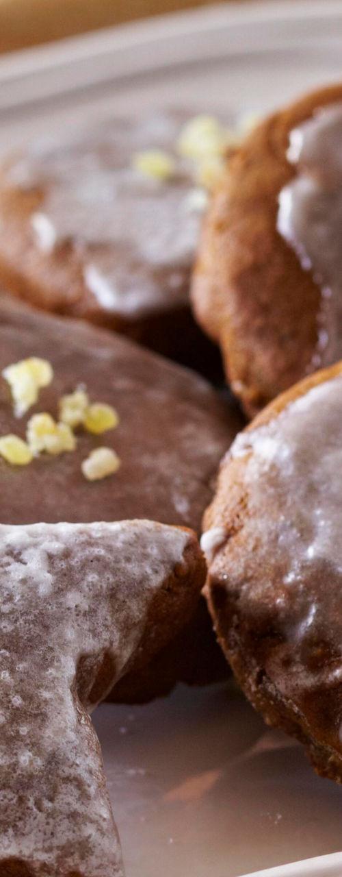Iced gingerbread cookies on white plate