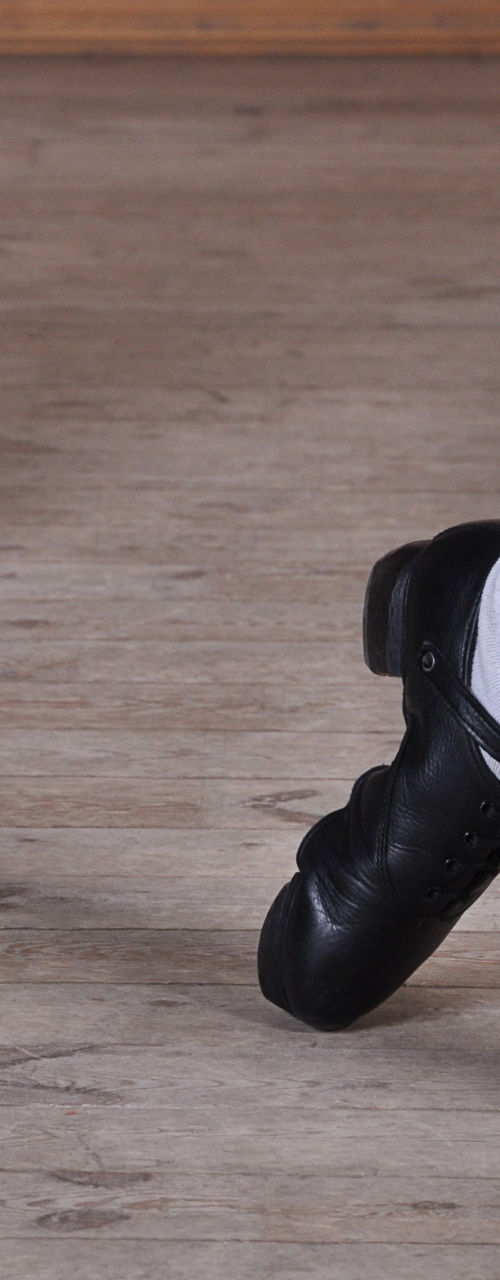Close-up of tap dancers' feet in motion