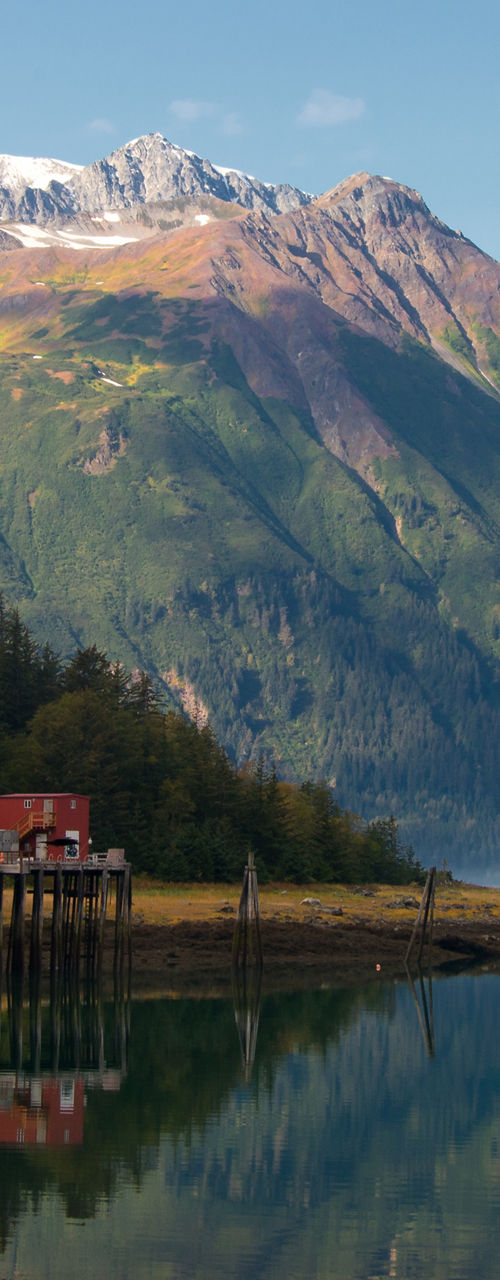 Scenic mountain lake with red cabins