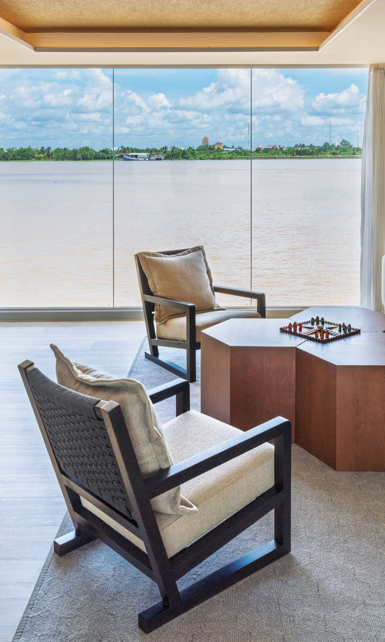 Modern riverfront lounge with workspace and seating area