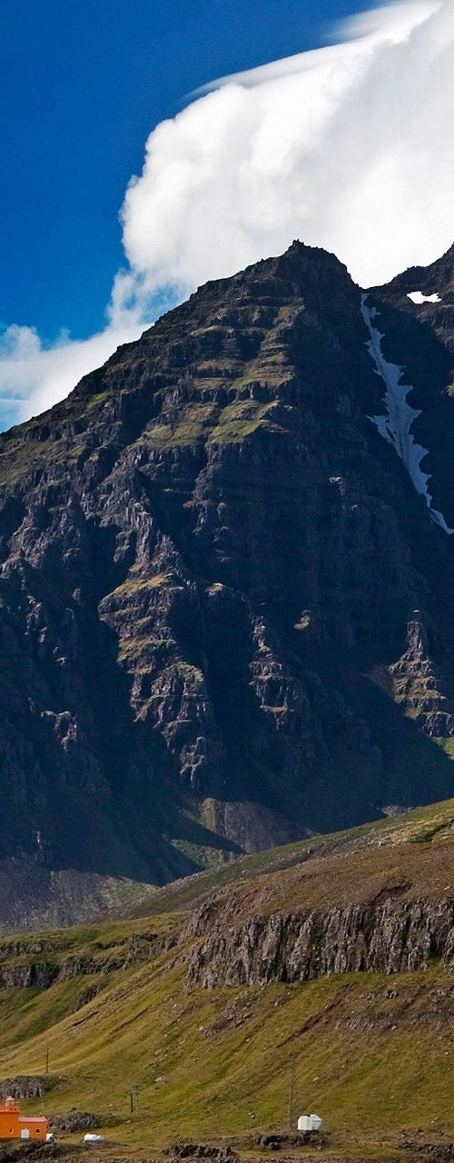 Scenic coastal mountains under vibrant sky