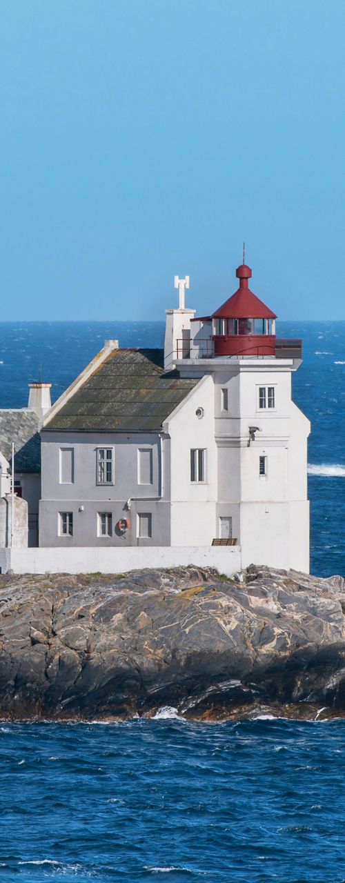Coastal lighthouse on rocky island