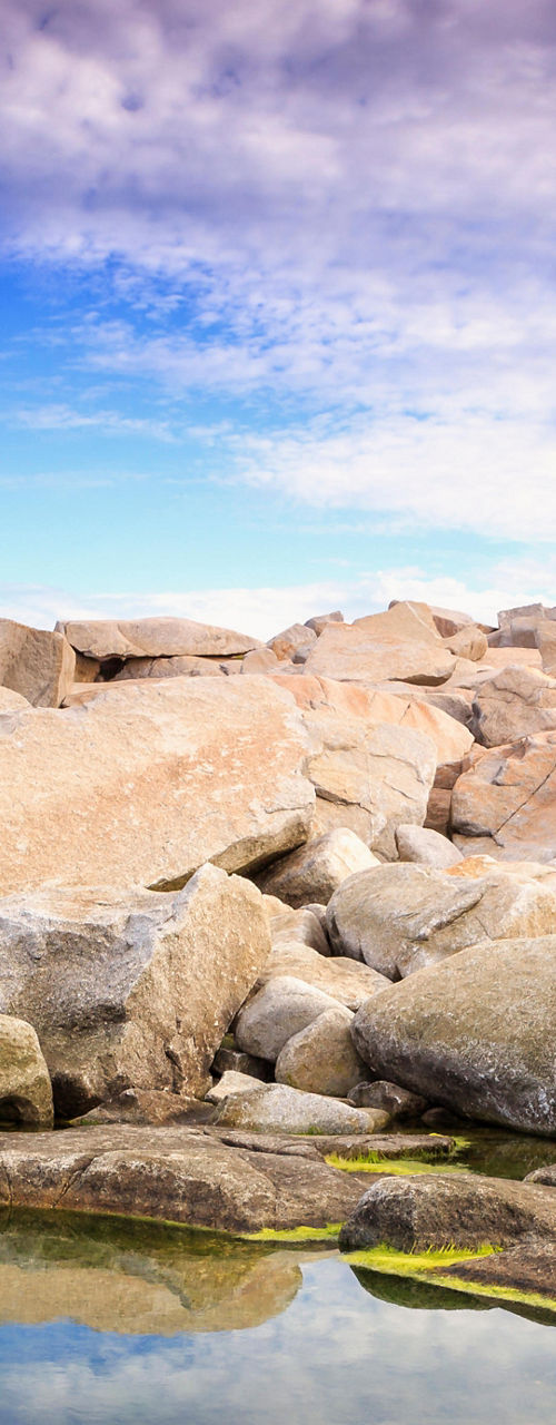 Scenic lighthouse on rocky coastline