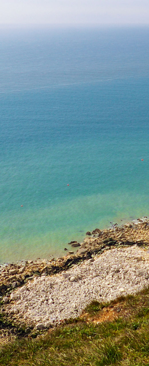 White cliffs and lighthouse by the sea