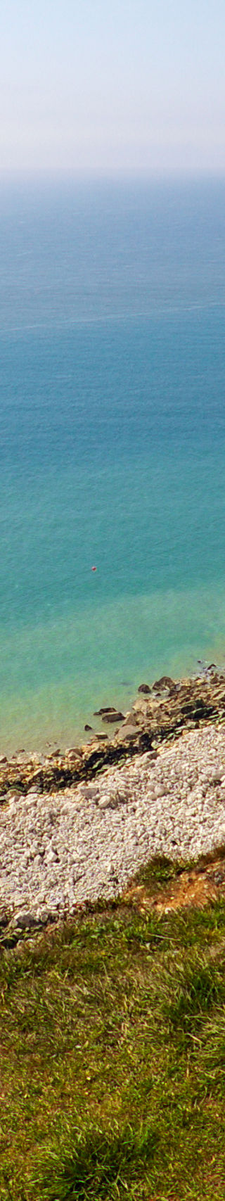 White cliffs and lighthouse by the sea