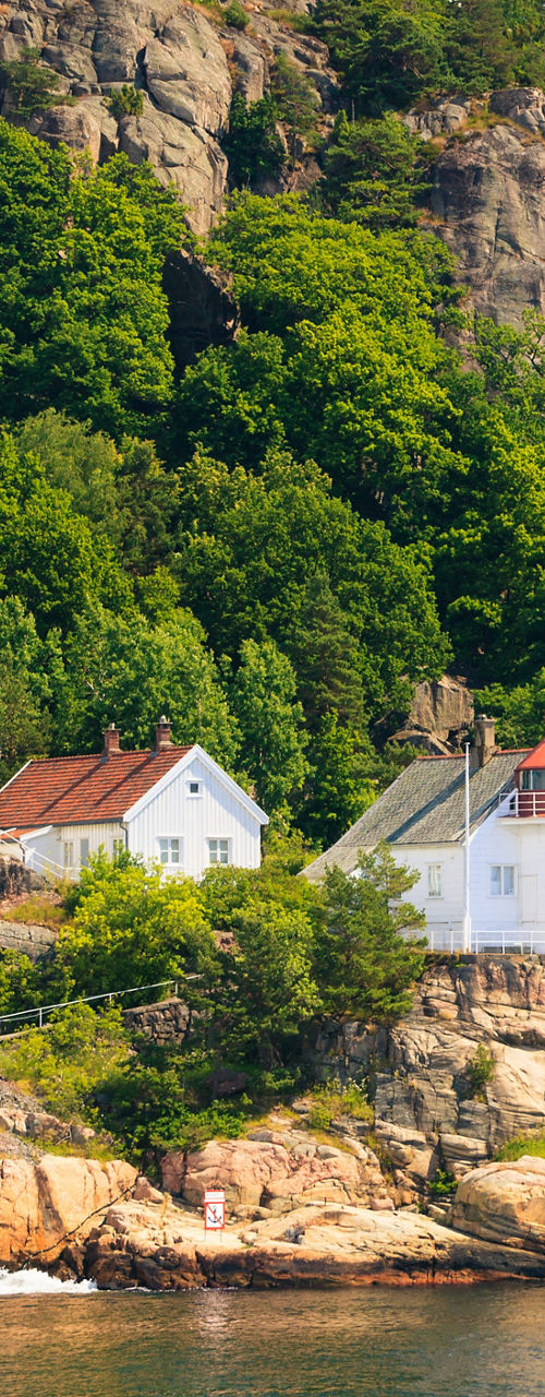 Scenic lighthouse by rocky coastline