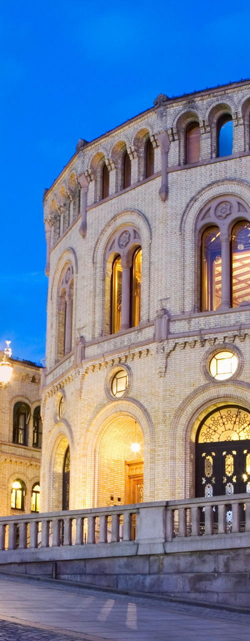 Norwegian Parliament building at dusk