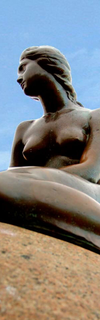 The Little Mermaid statue on rock