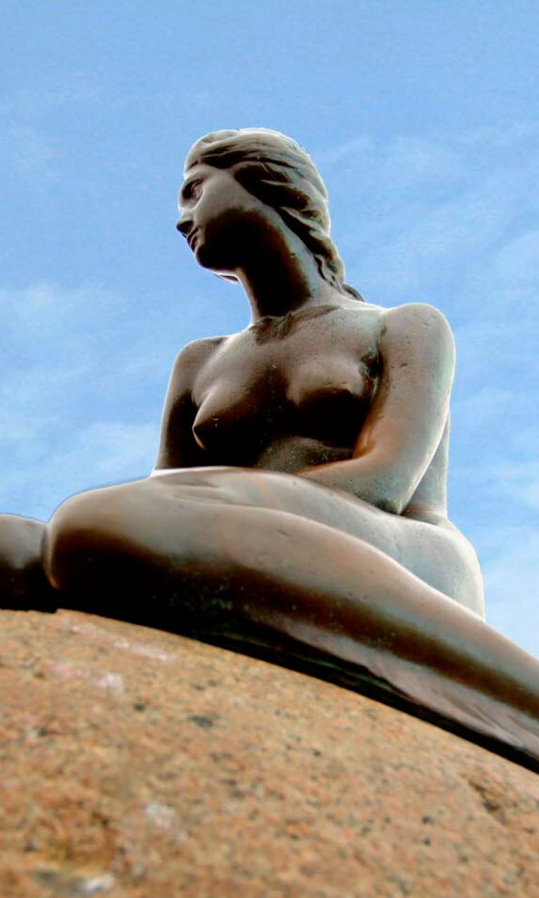 The Little Mermaid statue on rock