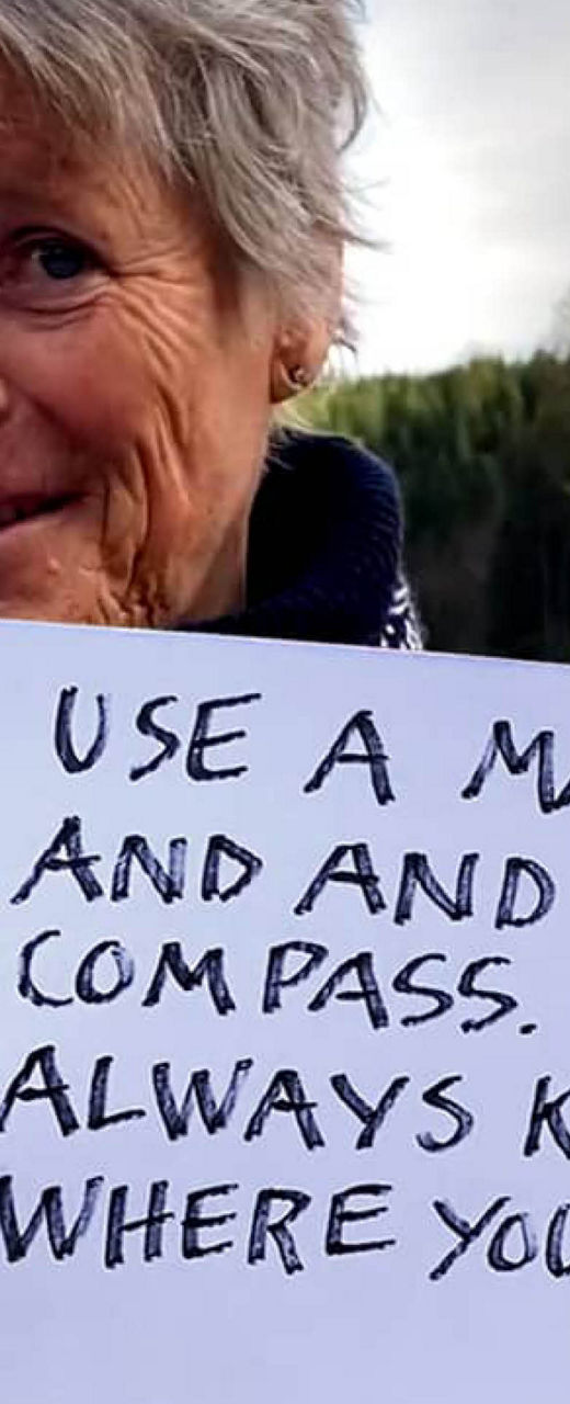 Handwritten outdoor navigation advice by a lake