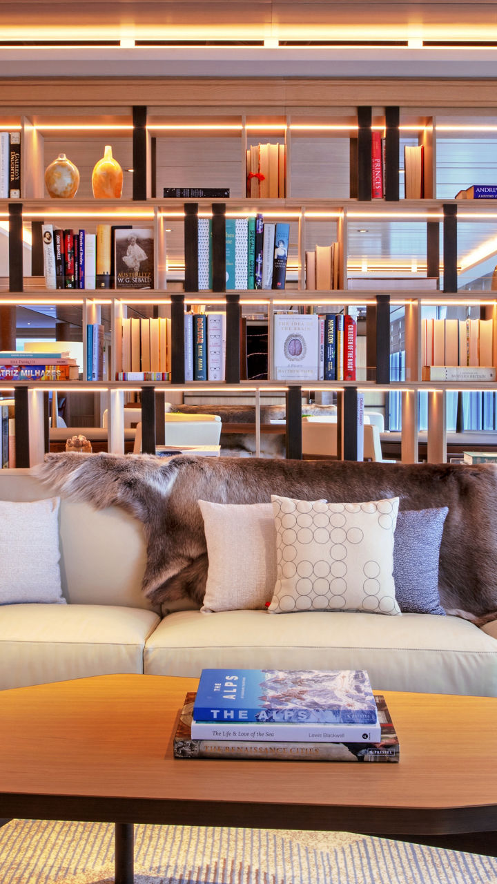 Modern living room with bookshelf and cozy seating