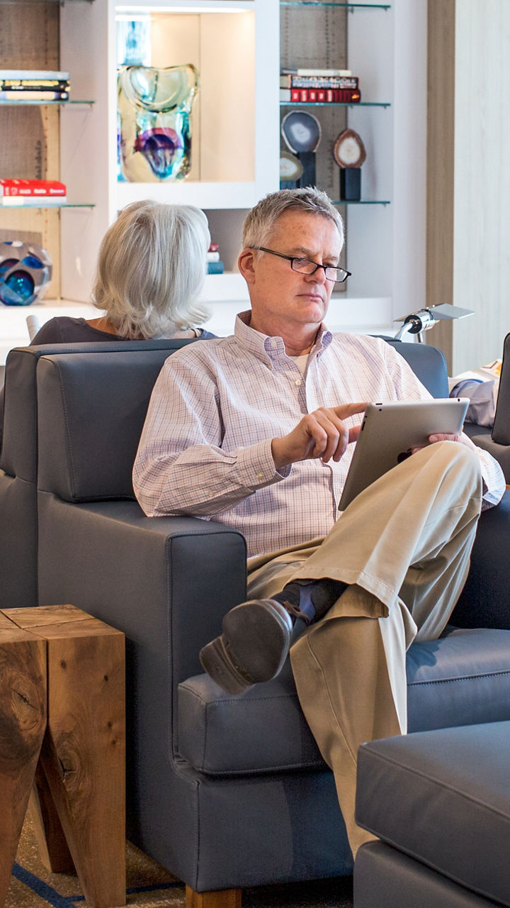 Older adults relaxing in modern lounge