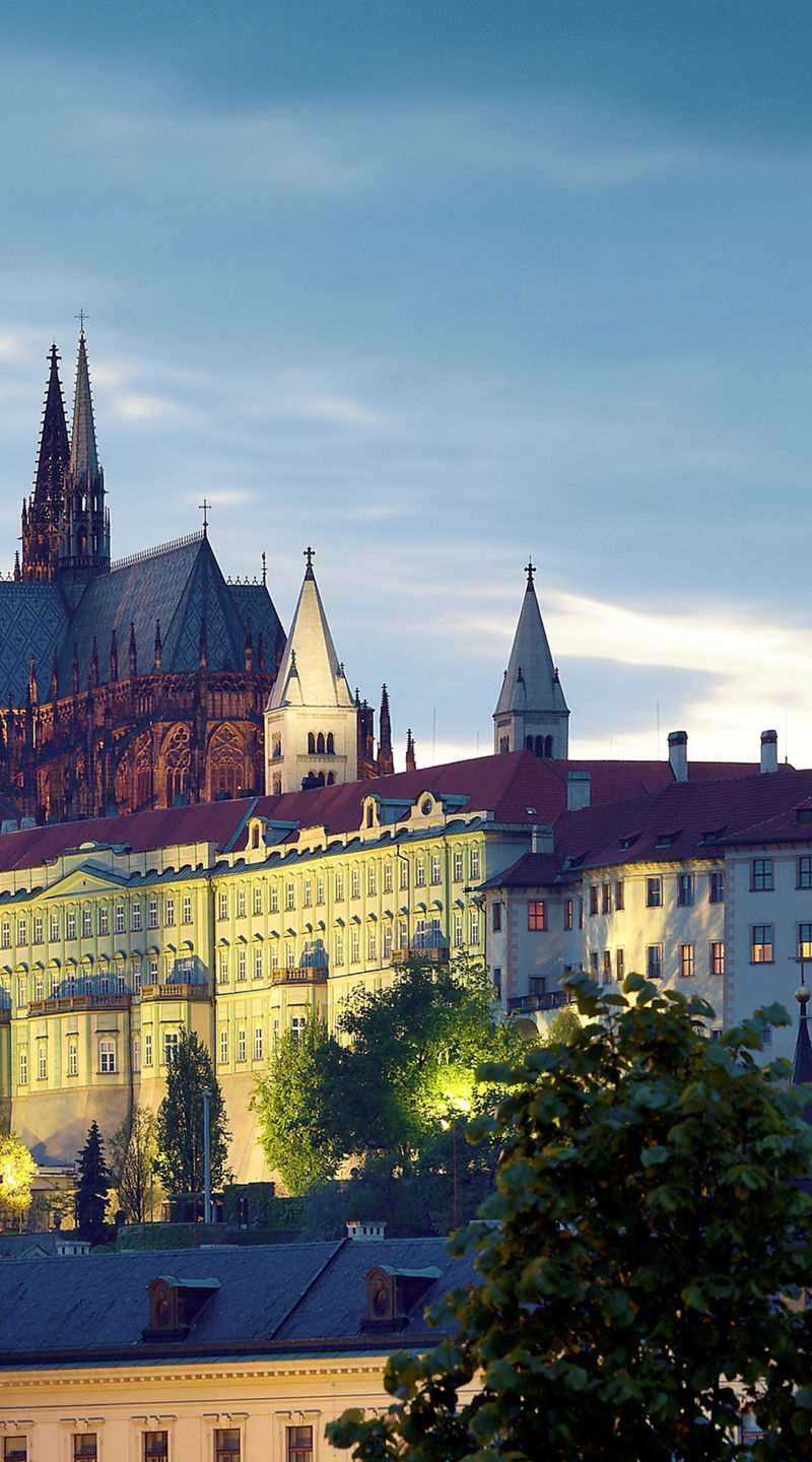 Prague Castle at dusk with streetlamp