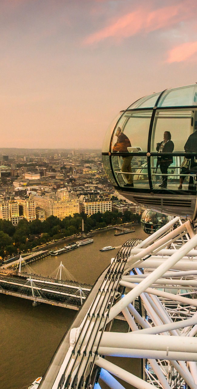London Eye capsule overlooking cityscape at sunset