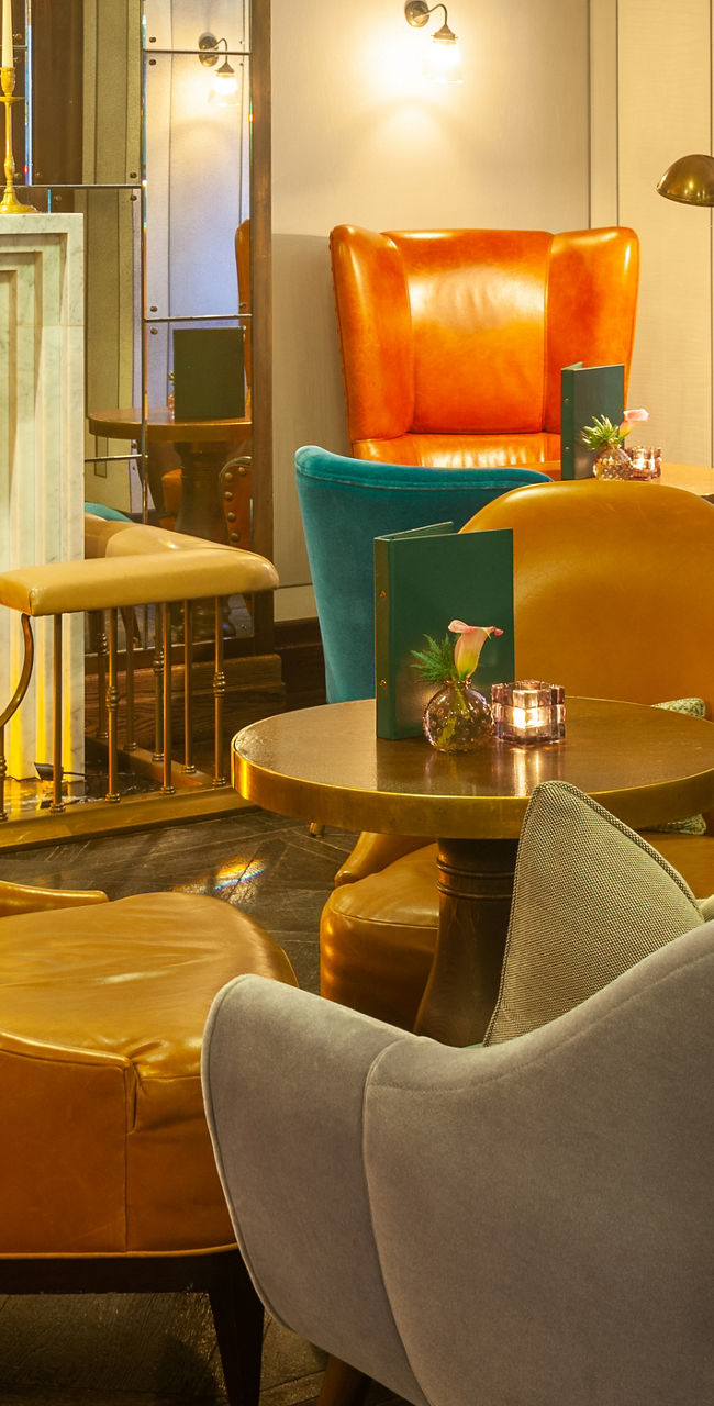 Cozy lounge with vibrant seating and fireplace