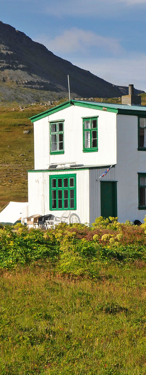 White house in rural mountain landscape