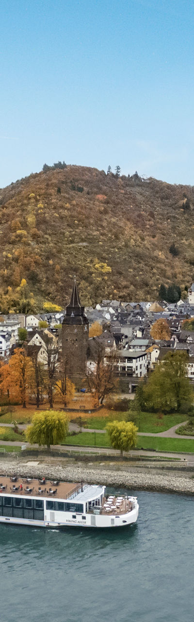 Scenic river cruise near hillside castle