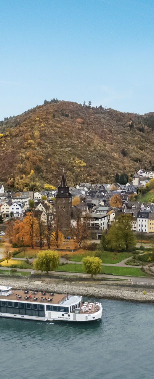 Scenic river cruise near hillside castle