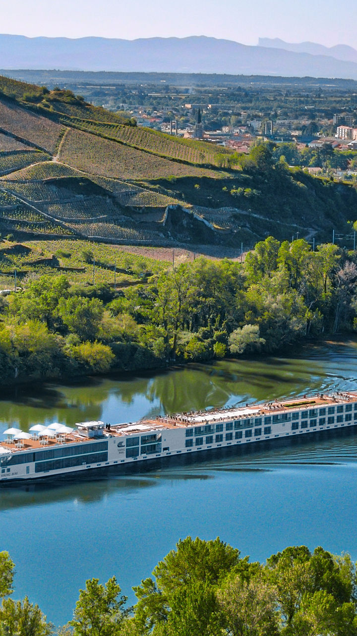 Scenic river cruise through lush valley