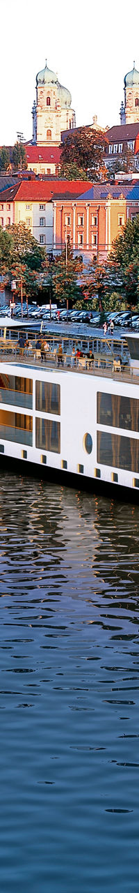 Luxury river cruise ship in scenic town