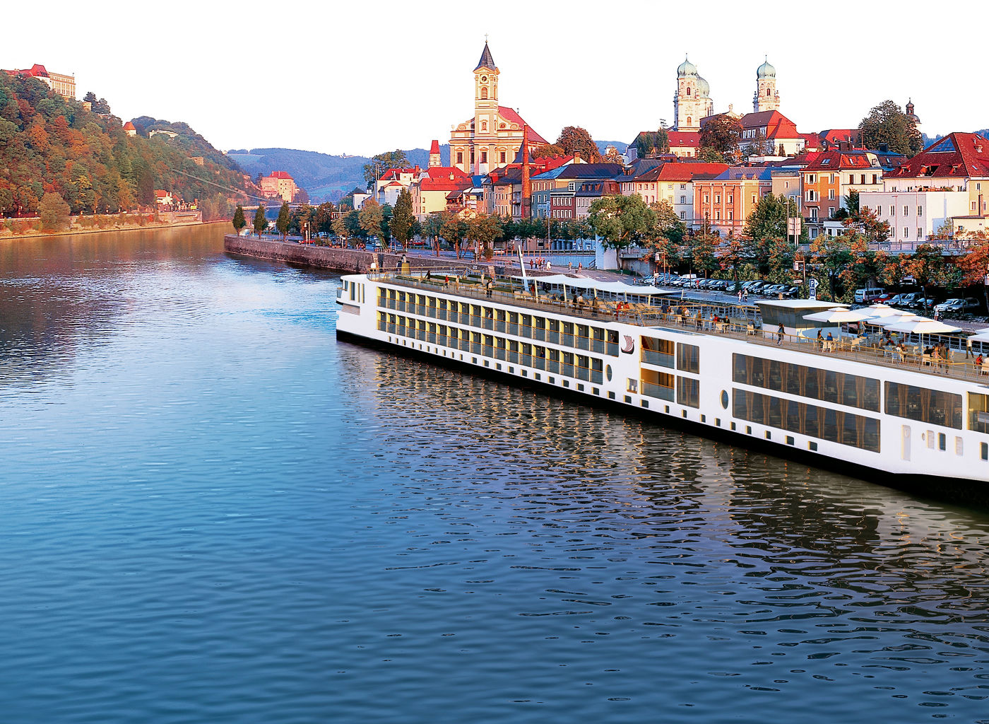 Luxury river cruise ship in scenic town