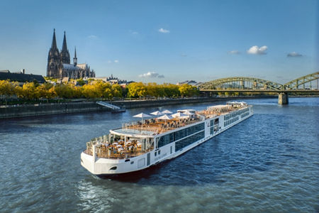 River cruise ship near Cologne Cathedral