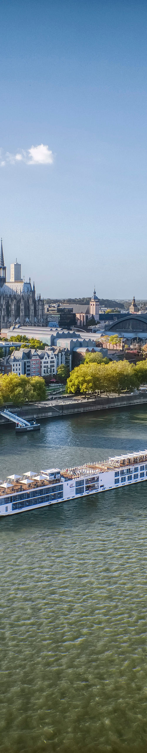 River cruise ship passing historic European city