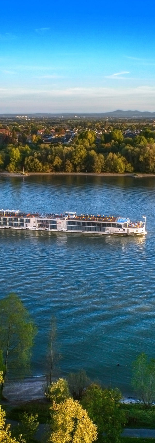Scenic river cruise ship on calm waters