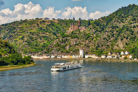 Scenic river cruise with hillside castle view