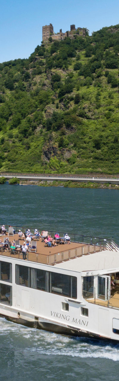 Luxury river cruise ship on scenic waterway