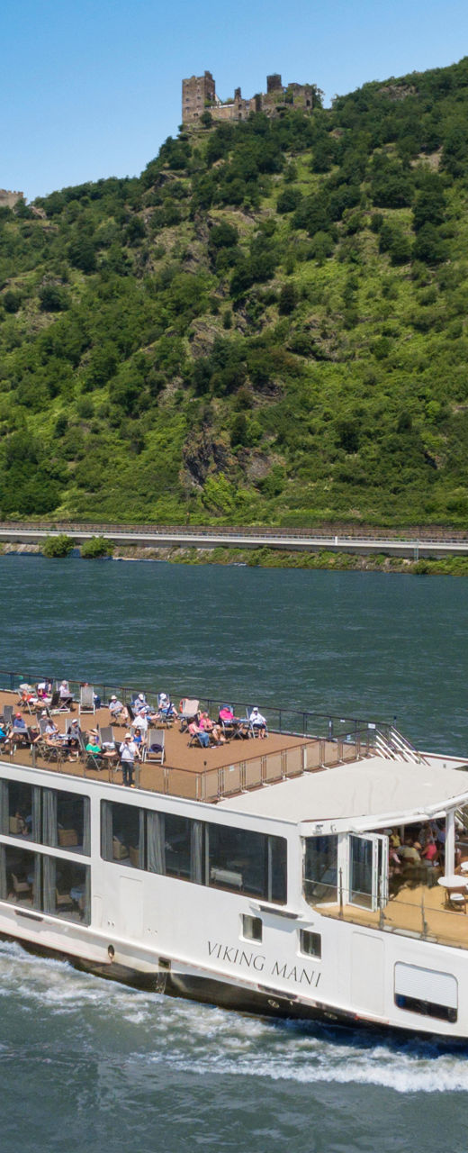 Luxury river cruise ship on scenic waterway
