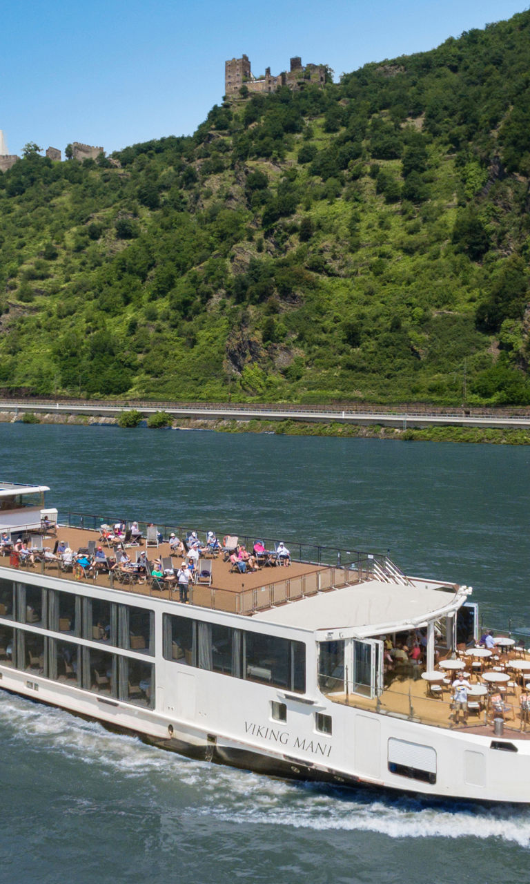 Luxury river cruise ship on scenic waterway