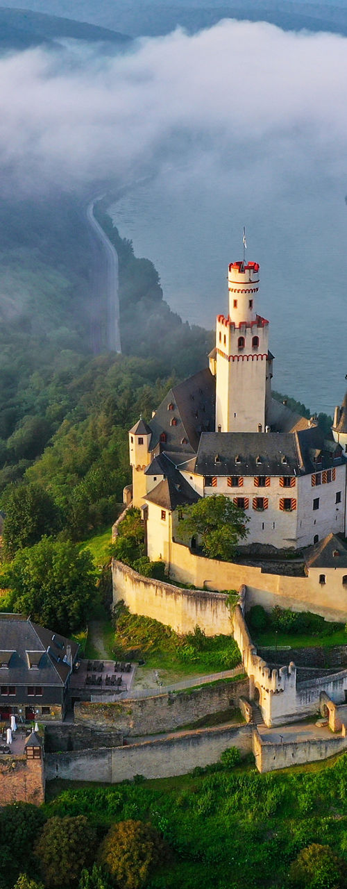 Aerial view of historic castle by river