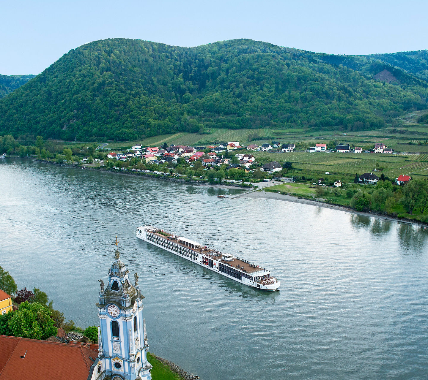Scenic river cruise through lush valley