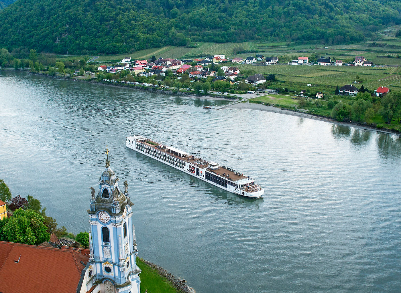 Scenic river cruise through lush valley