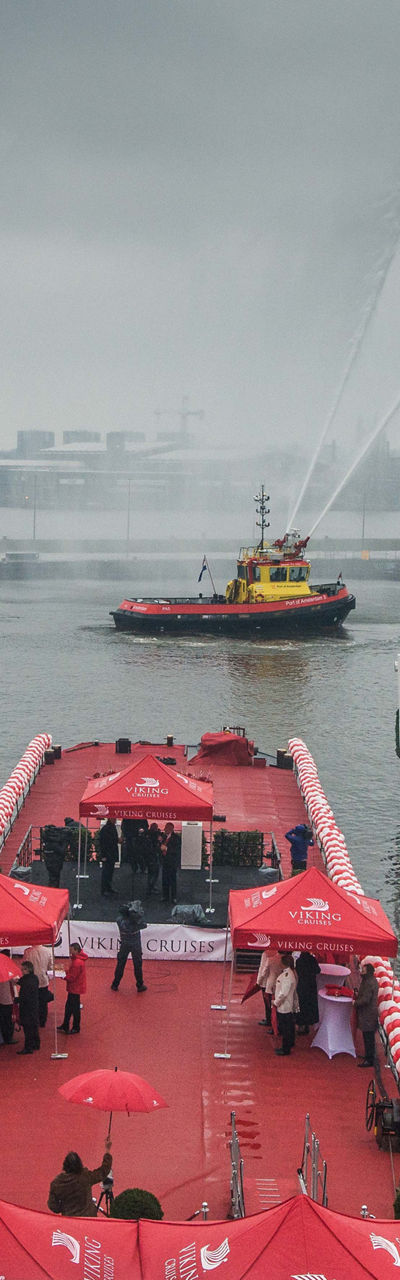Harbor Celebration with Decorated Boats and Tugboat Display